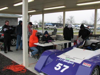 THAT'S ME THE ORANGE SWEATER, IT WAS COLD AT CMP, BUT WE TRIED TO KEEP WARM AS WE WEIGHED IN THE RACE CARS AFTER THE RACES