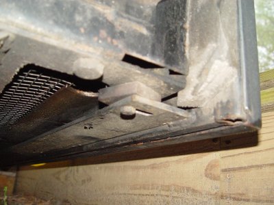 THE BOTTOM OF THE DOOR FRAME IS ATTACHED TO THE GENSET DRAWER USING BOLTS AND NUTS THROUGH THIS BRACKET AND SPACERS