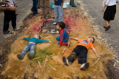 Before they are swept away, kids find one last use for the alfombras.
