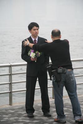 Photographer arranges groom