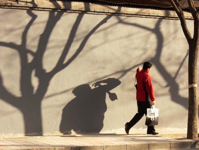 Walking with shadows, Beijing, China, 2006