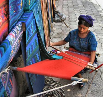 weaving small carpets with hand loom (Guatemala).JPG