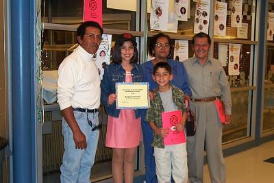 Angela wins Cinco de Mayo Award  2002 (shown with Nick and Uncle Emilio and grandparents)