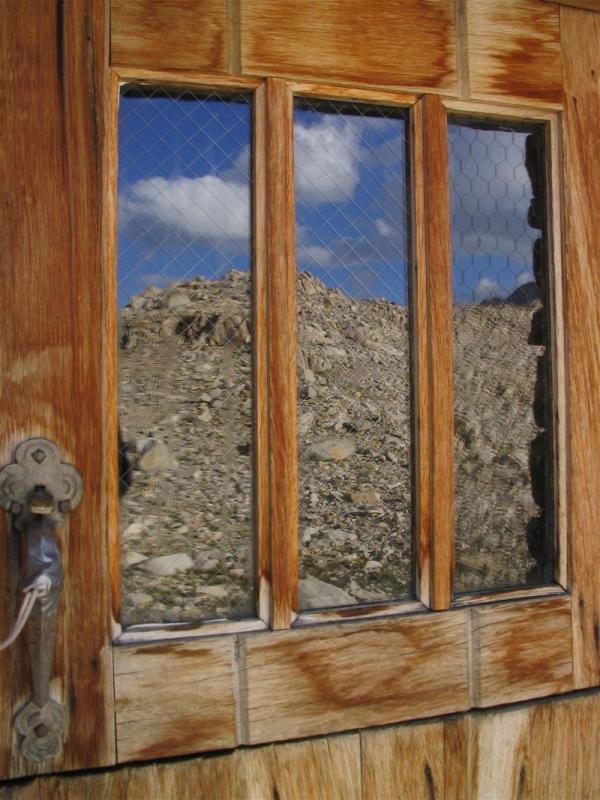 Reflections of the Sierra on the Shelters door window