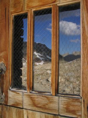 Reflections of the Sierra on the Shelters door window