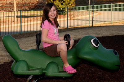 Jacklyn riding the dinosaur