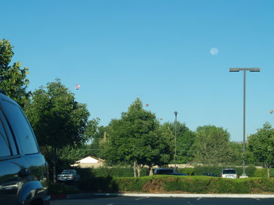 do you see four balloons and the moon?