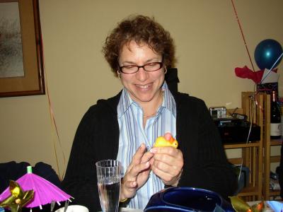Kate briefly ponders if perhaps she too should attempt to adhere the rubber birthday ducky to her face