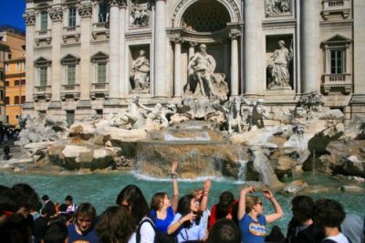 Coins flung into Trevi Fountain