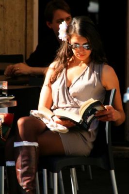 Woman reading in a cafe