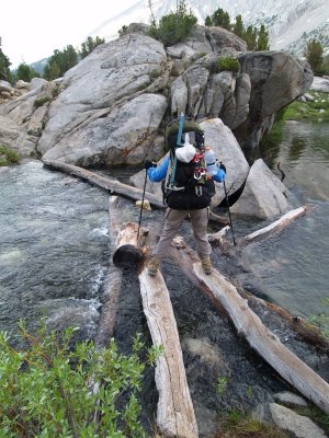 P7052306 Hiker crossing between upper and lower Rae lakes.JPG