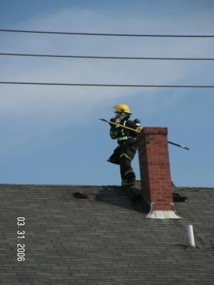 Fall River firefighter on Roof Eastern Ave