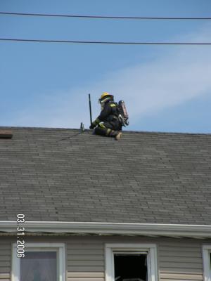 Fall River Firefighter on roof Eastern Ave.