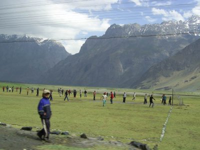 Football game. Afghan mountains in the background