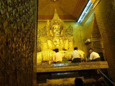 gold leaves are applied constantly by worshippers.....