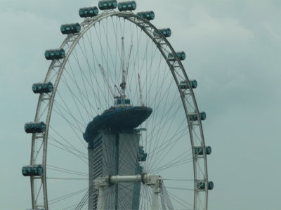 the building in the background has a ship being constructed on the top