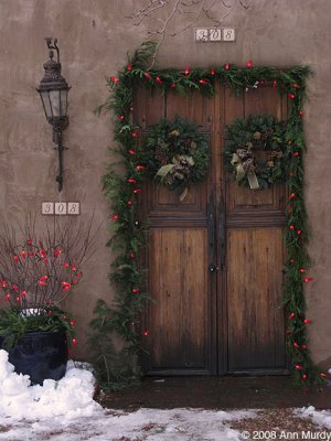 Wooden door with wreaths