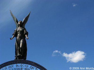 Dark Angel with wispy clouds