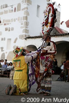 Subalterno kneeling before 1st Teotil