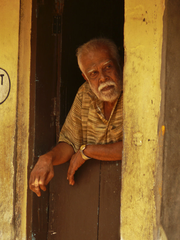 Man in doorway Trivandrum.jpg