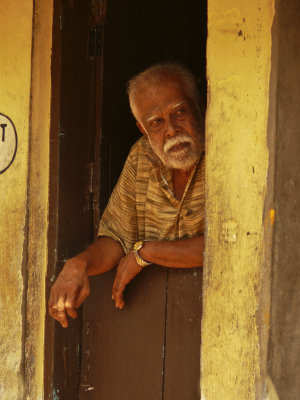 Man in doorway Trivandrum.jpg