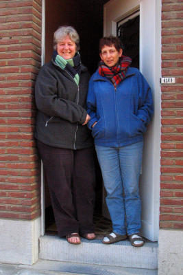 Cecilia and Leen in front of their house