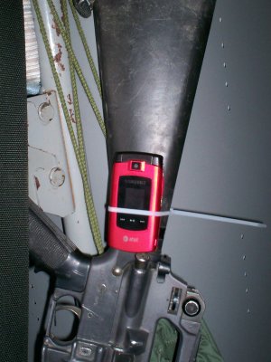 M16, cell phone, zip tie.