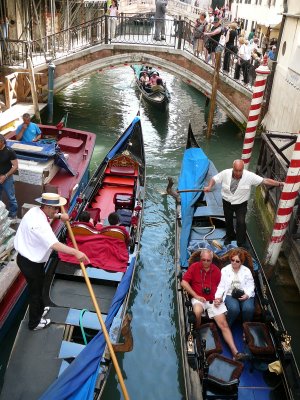 venice canal multiple bridges and multiple gondoliers (R)