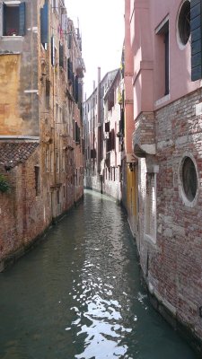 crowded small canal without street in venice (R)