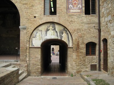 cool painting over walkway at church courtyard in san gimignano (G)