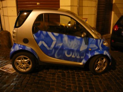 funky paint job on this smart car (R)