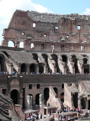tourists all around the inside of the colosseum (R)