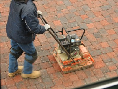 Tamping the pavers so they are level