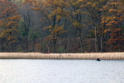 Small boat on pond