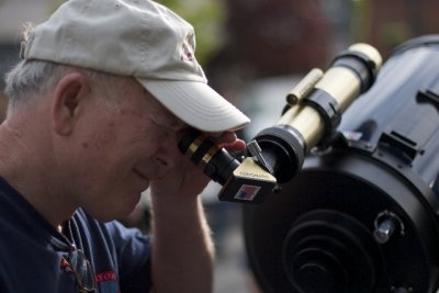Me looking through H-Alpha 40 mm solar scope