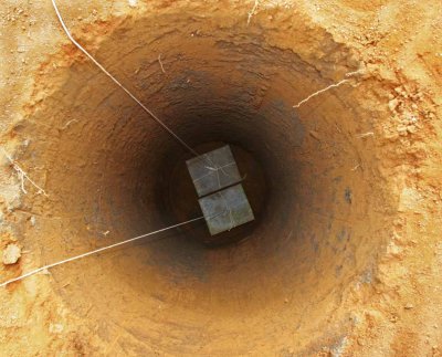 1 Dec 2007, Two pavers were lowered into the hole to form a firm footing for the pier