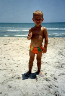 Wade at beach in speedos