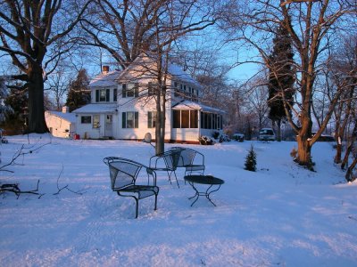 farmhouse and lawn chairs