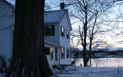 farmhouse and oak tree at dawn