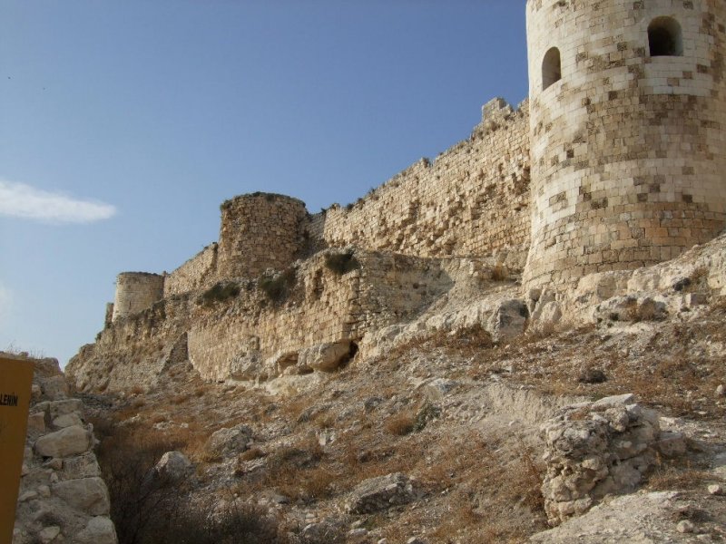 The moat and 3 of the 23 towers.
