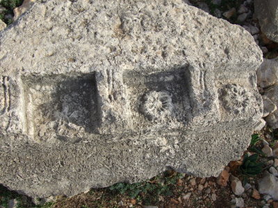 This is pat of the overhang showing carvings of flowers.