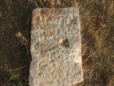 Here is an old-looking tombstone, but the grave is really not so old.  See the next photo.