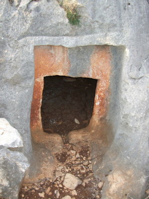 Close-up of the tomb door.  The inside floor was covered in red mud; who knows what might be buried there.