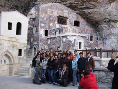 Tour group outside the rock church, the first building from the late 400s.