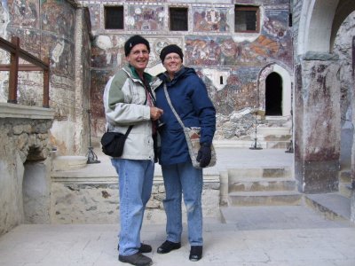 Carol and Bob in front of the rock church