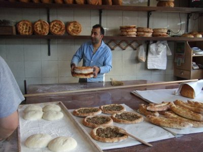 The bread would fly out of the oven and this man would catch it.