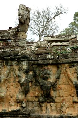 lion-headed figure and garuda, all with raised arms