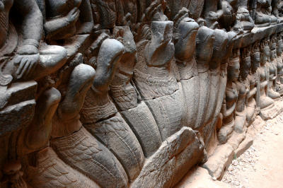 nagas on the lower register of the walls and the corner angles