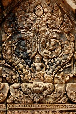 Kubera, God of the North, supported by simhas (lions)