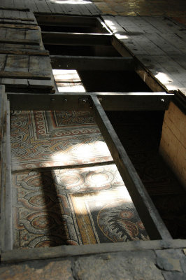 wooden trapdorrs are usually left open to reveal parts of Constantine's 4th-century mosaic floor